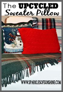 Don't throw out that old sweater! Learn how to make an upcycled sweater pillow at Sparkles of Sunshine.
