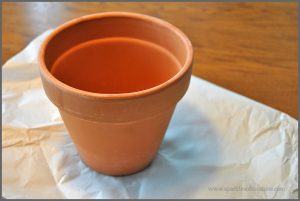 Decorate your space with a Fabric Covered Flower Pot. Visit Sparkles of Sunshine to learn how to use Mod Podge and fabric to decorate your boring flower pots!