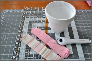 Decorate your space with a Fabric Covered Flower Pot. Visit Sparkles of Sunshine to learn how to use Mod Podge and fabric to decorate your boring flower pots!