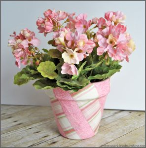 Decorate your space with a Fabric Covered Flower Pot. Visit Sparkles of Sunshine to learn how to use Mod Podge and fabric to decorate your boring flower pots!