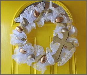 Check out this Golden Egg Easter Wreath made with plastic eggs, lace and a hot glue gun at Sparkles of Sunshine.