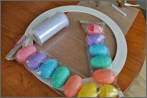 Check out this Golden Egg Easter Wreath made with plastic eggs, lace and a hot glue gun at Sparkles of Sunshine.