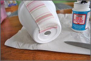 Decorate your space with a Fabric Covered Flower Pot. Visit Sparkles of Sunshine to learn how to use Mod Podge and fabric to decorate your boring flower pots!