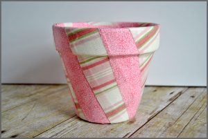 Decorate your space with a Fabric Covered Flower Pot. Visit Sparkles of Sunshine to learn how to use Mod Podge and fabric to decorate your boring flower pots!