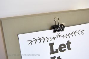 Turn an old piece of thrift store art into an upcycled clipboard easy art display piece!
