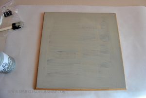 Turn an old piece of thrift store art into an upcycled clipboard easy art display piece!
