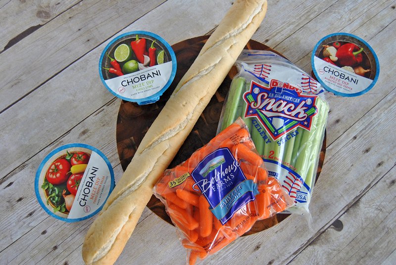 Looking for a fun way to serve dip at your next party? Use Chobani Meze Dip and veggies to add some flavor to baguette slices for a colorful appetizer.
