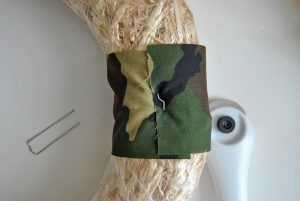 Switch things up this year with a unique test on a traditional harvest wreath. This camo fall harvest wreath is perfect for hunters and their families.