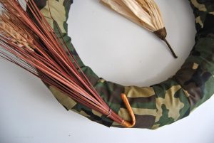 Switch things up this year with a unique test on a traditional harvest wreath. This camo fall harvest wreath is perfect for hunters and their families.