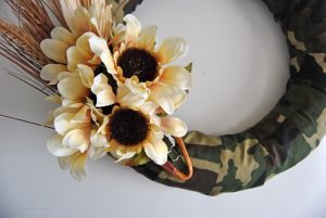 Switch things up this year with a unique test on a traditional harvest wreath. This camo fall harvest wreath is perfect for hunters and their families.