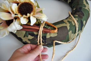 Switch things up this year with a unique test on a traditional harvest wreath. This camo fall harvest wreath is perfect for hunters and their families.