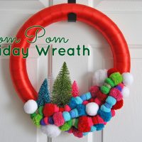 Add some color to your home this Christmas with the most wonderful, colorful pom pom holiday wreath. See the simple tutorial at Sparkles of Sunshine today.