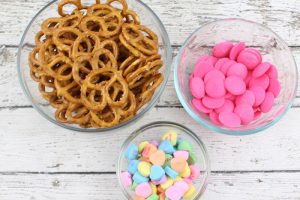 Spread the love this Valentine's Day by making these easy Conversation Heart Pretzel Bites.