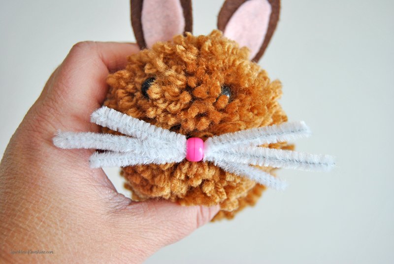Learn how to make pom pom Easter bunnies. These sweet little bunnies are the perfect addition to Easter baskets!